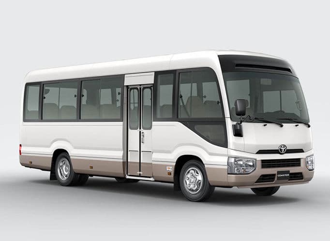 Toyota Coaster Bus — Mini Bus for Umrah transport, seats up to 22 passengers